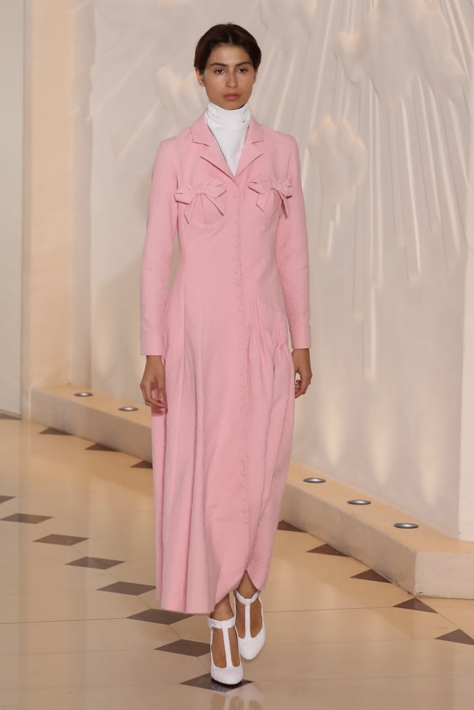 As soon as we spotted this bow-adorned blazer dress on the runway, we knew it was meant for Kate. She might modify the piece by shortening the hemline to get around easier, but we think she'd find this shade of pink to be just right.