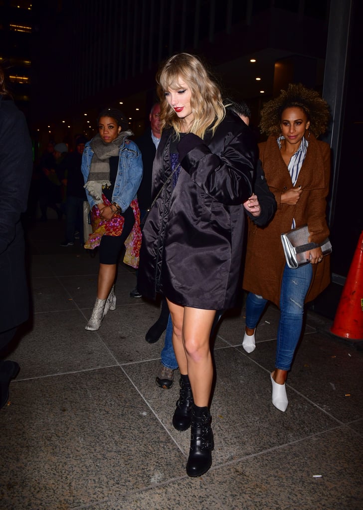 Taylor styled her triple-buckle Prada boots with an oversize bomber, a beaded minidress, and a bejeweled crossbody bag.
