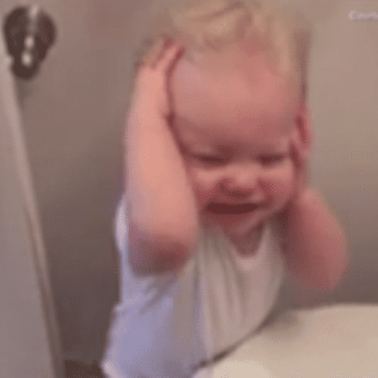 Toddler Excited by Hair Blow Dryer