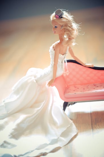 Barbie leans against the chaise lounge.
Photo by BdG Photography via Rock n Roll Bride