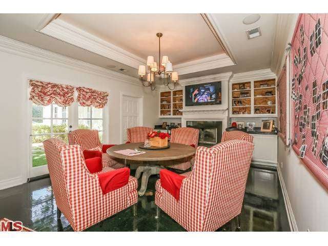 A cozy informal dining area with a French country theme is perfect for family meals with the twins.