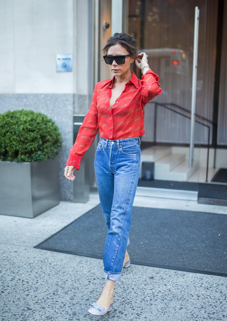 Wearing a red button-down shirt, mom jeans, and a pair of glitter mules.