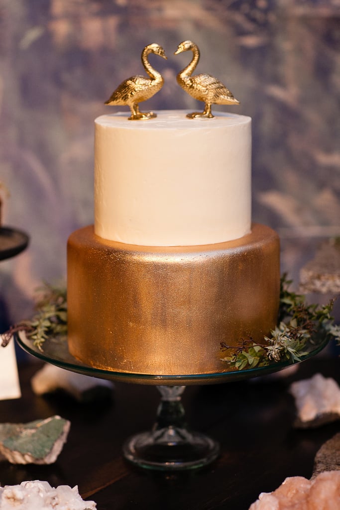 This modern cake has a bit of whimsy with graphic gold detail that pops against the cake's white fondant.