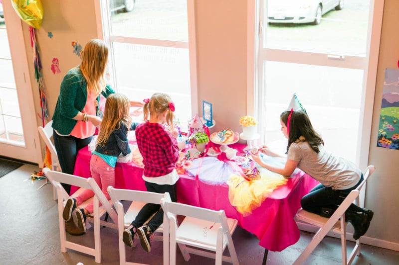 After the Beauty Bar, the girls headed to “Rarity’s Carousel Boutique” to create a party skirt, necklace, and pick out a party hat (custom made by Oh Goodie Designs). I ordered tulle skirts from TomKat Studio and found an embroidery genius on Etsy to make cutie mark patches the girls could fabric glue onto their skirts. As luck would have it, I misplaced the cutie marks in the hustle and bustle of party set up. I was devastated. It didn’t stop the girls from picking a skirt, hat and designing necklaces though. But I was still bummed. (And of course found them the day after the party.)