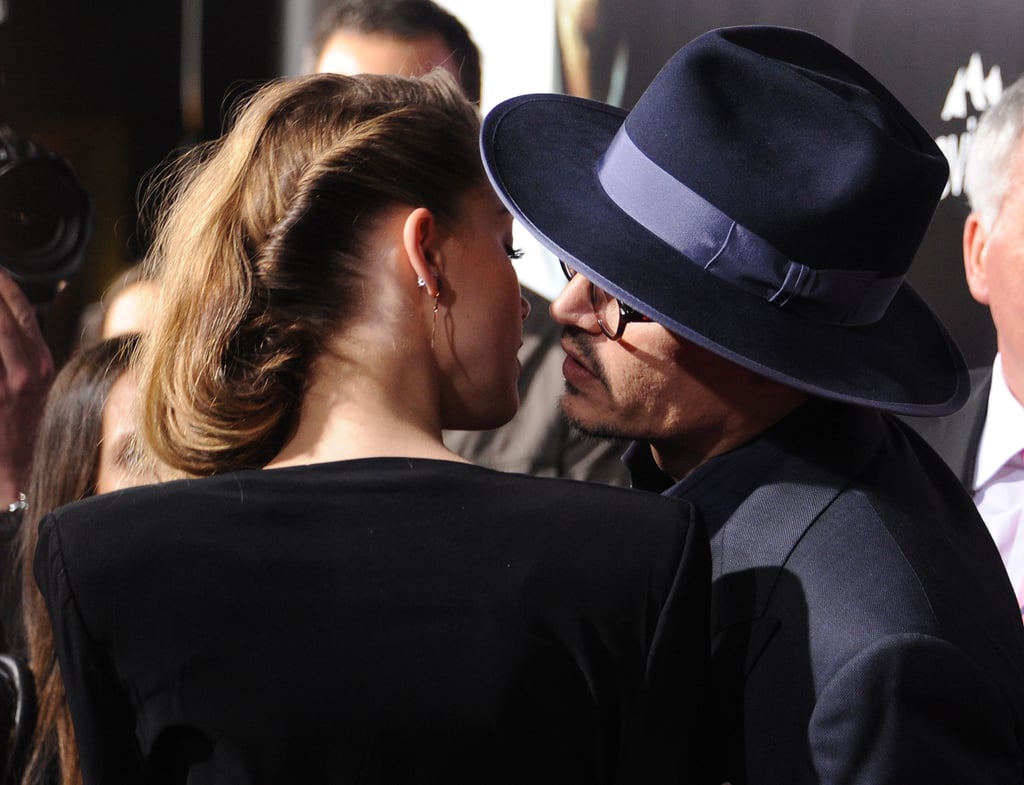 Recently engaged couple Johnny Depp and Amber Heard had a rare moment of PDA at her 3 Days to Kill premiere.