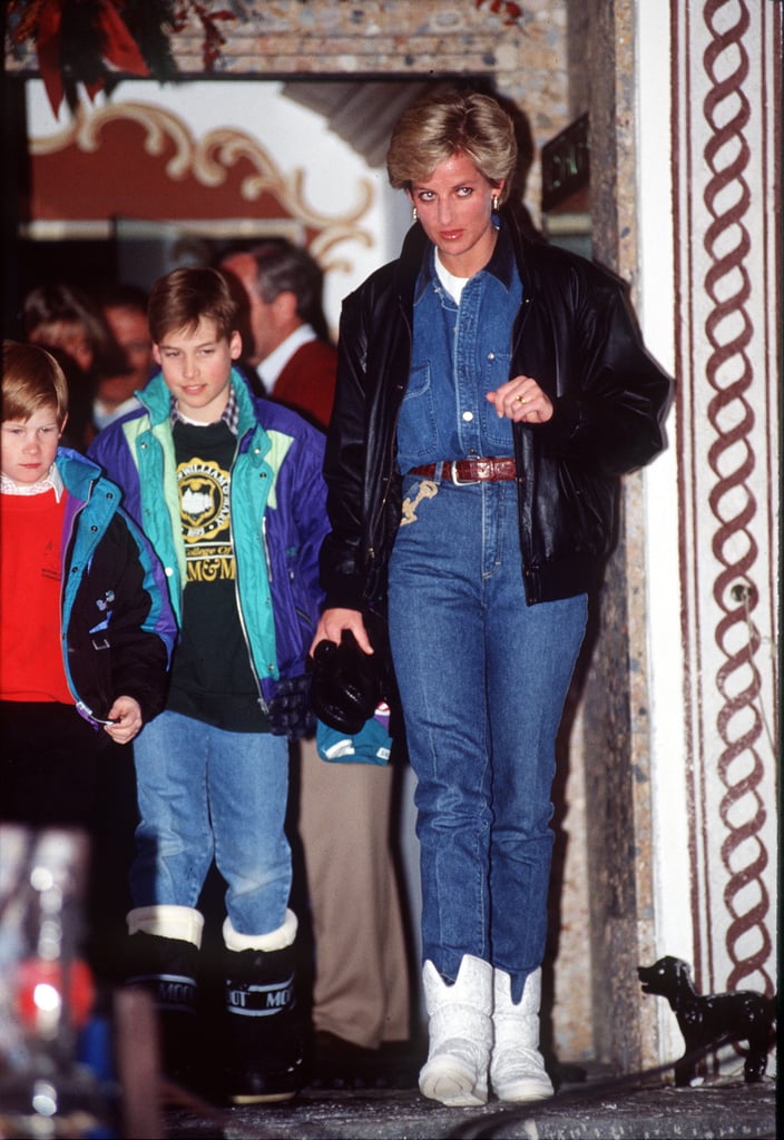 While on a skiing holiday in Lech, Austria, with Prince William and Prince Harry in March 1993, Diana showcased her own denim-on-denim style, separating her fitted pieces with a brown croc-effect belt, black leather jacket, and gold jewelry. Her white snow boots were a casual but sporty touch.