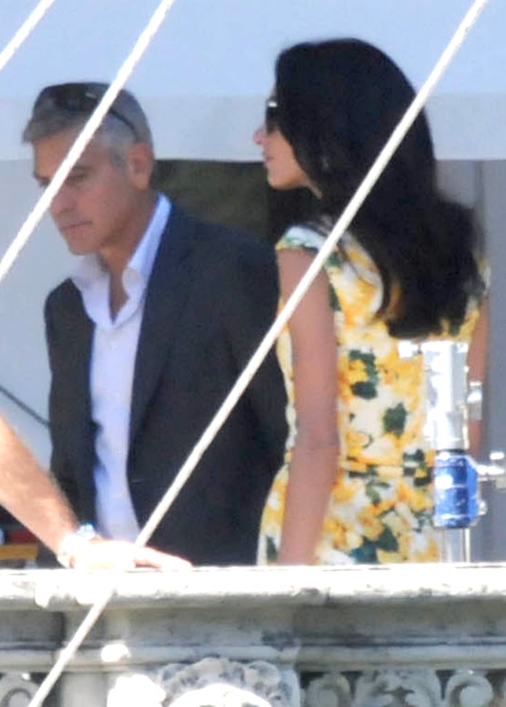 Amal Alamuddin stopped by an Italian set to see her fiancé, George Clooney, on Wednesday.