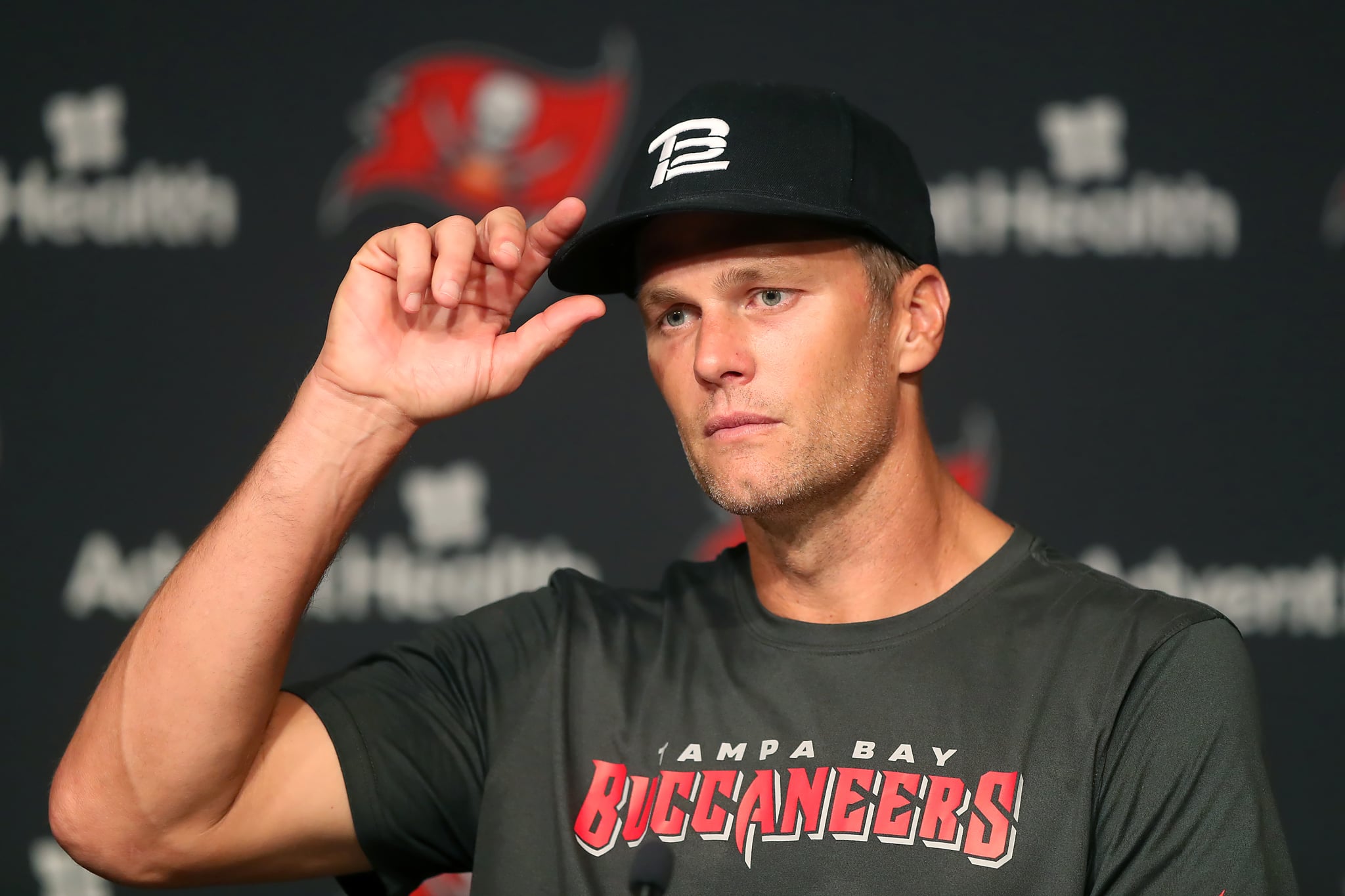 TAMPA, FL - JUN 09: Tampa Bay Buccaneers quarterback Tom Brady (12) speaks to the media after the Tampa Bay Buccaneers Minicamp on June 09, 2022 at the AdventHealth Training Centre at One Buccaneer Place in Tampa, Florida. (Photo by Cliff Welch/Icon Sportswire via Getty Images)