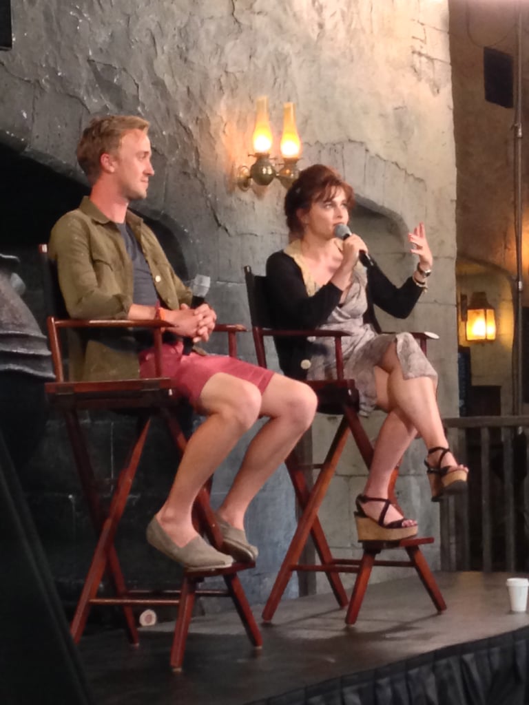 Tom Felton and Helena Bonham Carter, who play villains Draco Malfoy and Bellatrix Lestrange, answered questions during a panel. The two are far from villainous in their real lives. In fact, Helena shared that her two children (with partner Tim Burton), Billy and Nell, were "enchanted" with Diagon Alley. She added that Nell, who's 6, just started reading the first book.