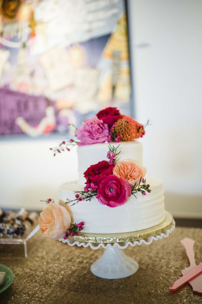 A soft texture on the base layer of this cake and the multitoned flowers are the perfect amount of detail to make this a beautiful dessert without going over the top.