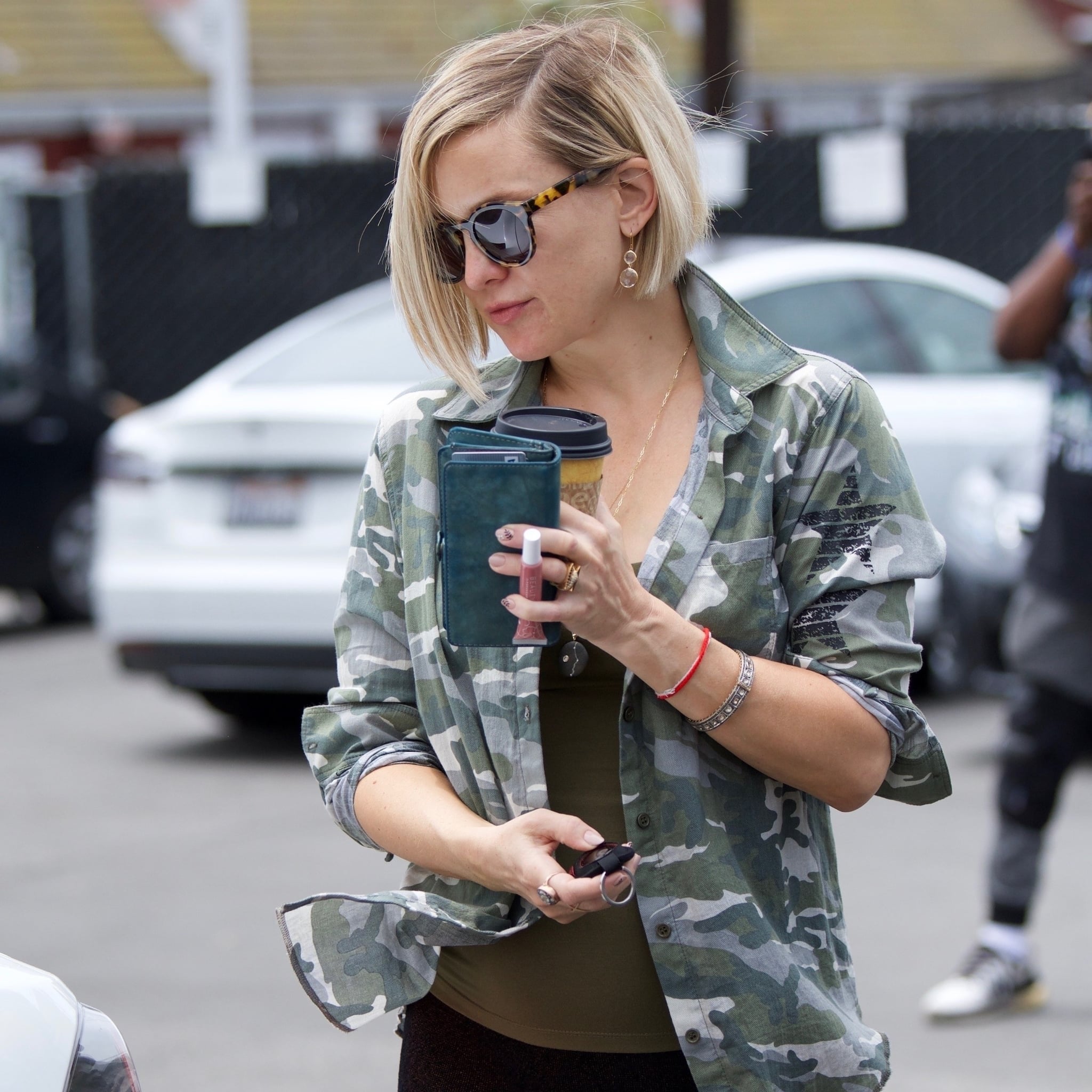 Kate Hudson Holding Beauty By Popsugar Be The Boss Lip Gloss Popsugar Fashion