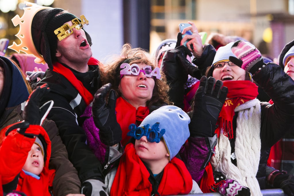 People sported 2014 glasses while they waited for the ball to drop in NYC.