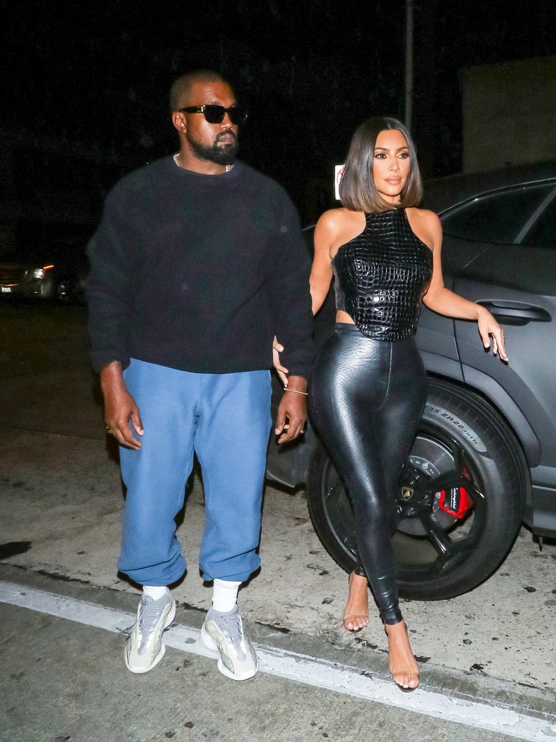 Kim Kardashian shows off her curves in skintight leather pants and