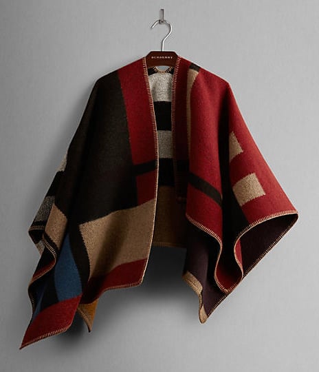 I've bought about seven capes/ponchos this season. If someone wanted to wrap the monogrammed Burberry style ($1,395) and put it under my Christmas tree, I would certainly not complain!