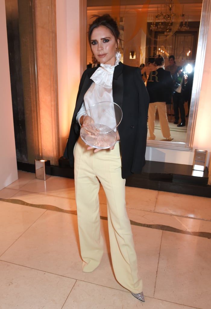 Victoria Beckham attended the Harper's Bazaar Women of the Year Awards wearing pieces from her Spring '18 collection. The designer opted for a more put-together look for the event, wearing a ruffled white blouse with a black tuxedo jacket thrown over her shoulders. Rather than finishing off her look with something you'd expect, like matching black pants, Victoria wore a pair of lemon-hued, wide-leg trousers and glitter heels. Have a look at her complete ensemble ahead, and buy similar versions of her trousers if you choose.

    Related:

            
            
                                    
                            

            20 Times Victoria Beckham&apos;s Shoes Were as Impressive as Her Outfits