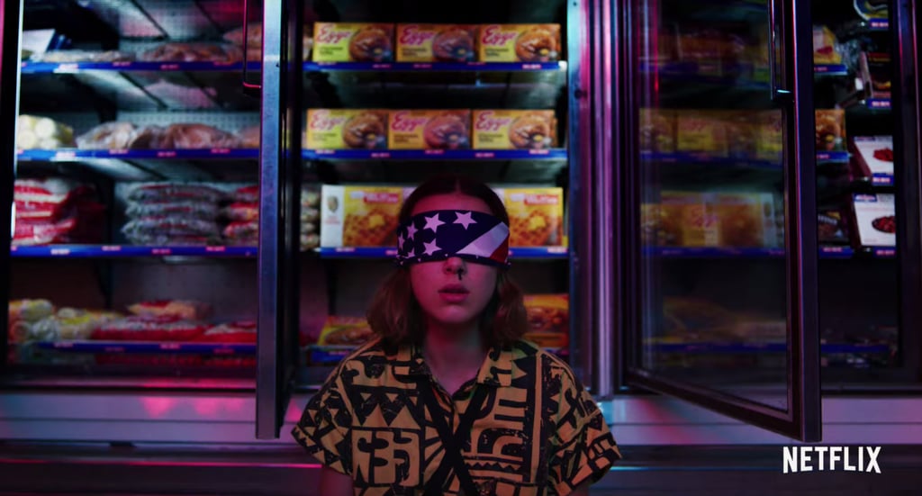 Eleven + Eggos = forever. (Note: she's wearing the same shirt as in the beach scene from earlier.)