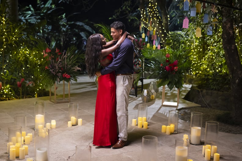 JaNa Craig and Kenny Rodriguez stand amid candles looking into each other's eyes on the sixth season of Love Island USA.
