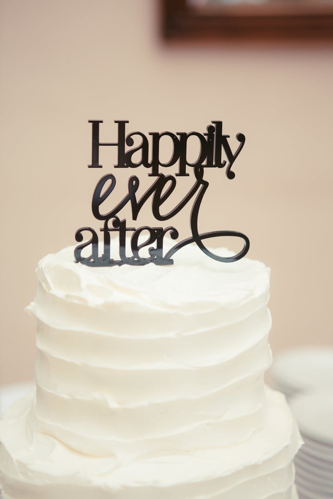 Here, less is more: rustically frosted and topped with a black "Happily ever after," this cake is sleek and sophisticated..