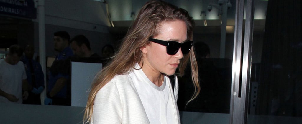 Mary-Kate Olsen Wearing a White Coat at the Airport