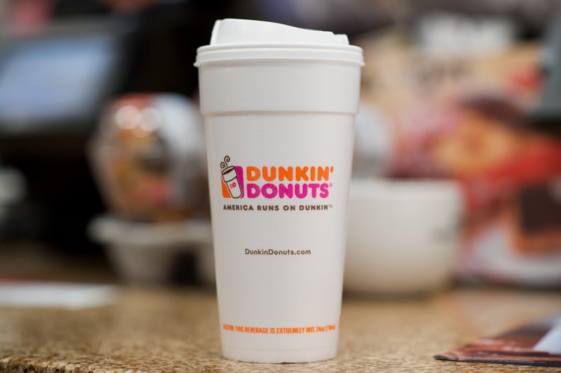 A cup with coffee is displayed for a photograph at a Dunkin Donuts Inc. store in Manhattan, New York, U.S., on Wednesday, Feb. 5, 2014. Dunkin Donuts Inc. is scheduled to release earnings figures on Feb. 6. Photographer: Craig Warga/Bloomberg via Getty Im