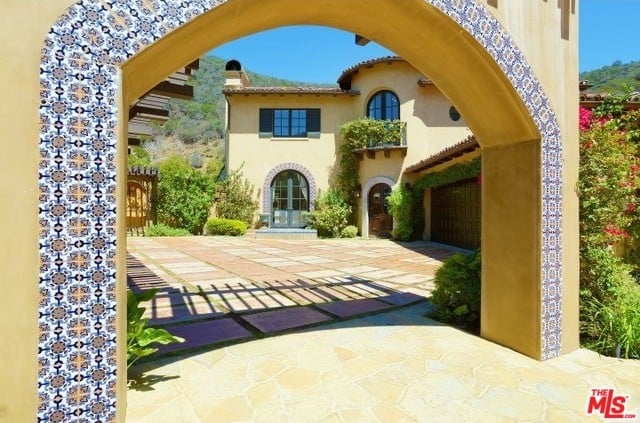 Lauren and her guests will enter the one-acre property through this beautiful tiled archway.