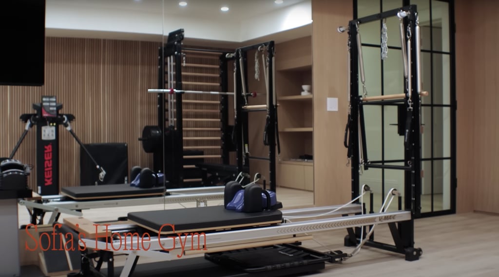 Richie Grainge's home gym has a Pilates reformer machine, weights, and kettlebells.