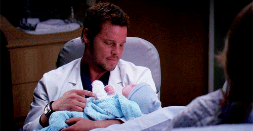 Karev Tenderly Checking Up On a Newborn or Child