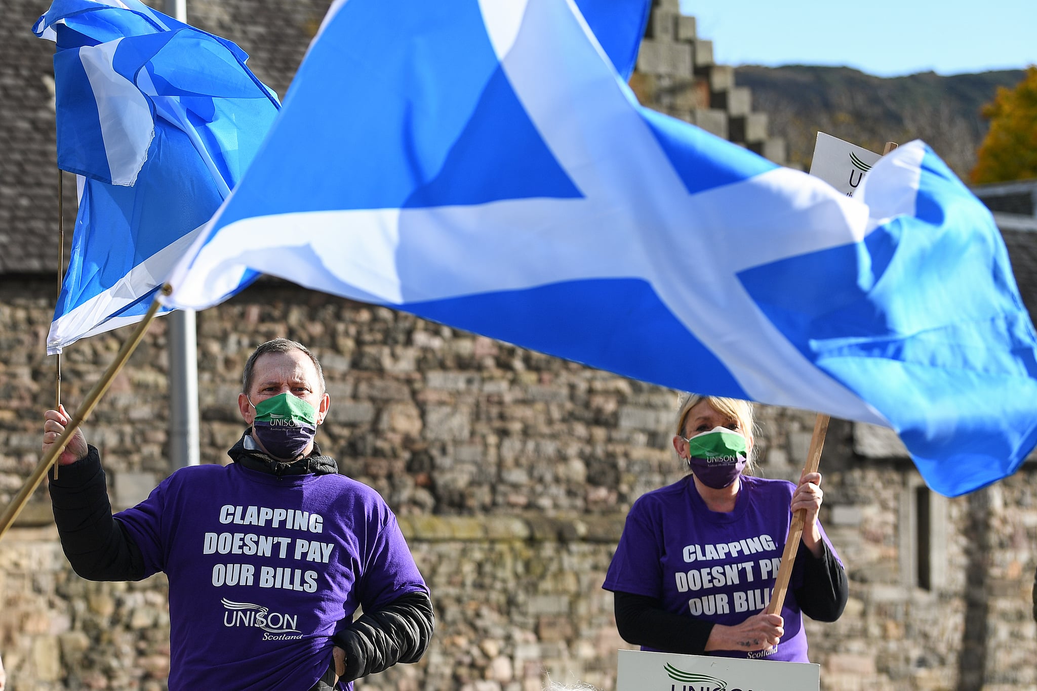 EDINBURGH, SCOTLAND - NOVEMBER 05: NHS workers protest over their pay demands outside Scottish Parliament on November 5, 2020 in Edinburgh, Scotland. Unison trade union has invited health secretary Jeane Freeman and other politicians to meet its members to discuss calls for the three year NHS pay deal to be renegotiated due to the coronavirus pandemic. (Photo by Jeff J Mitchell/Getty Images)