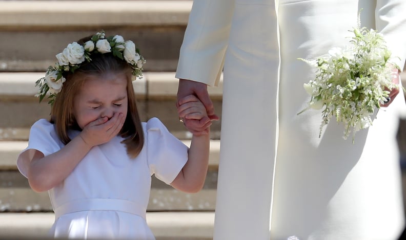 WINDSOR, UNITED KINGDOM - MAY 19:  Princess Charlotte of Cambridge stands on the steps with her mother Catherine, Duchess of Cambridge after the wedding of Prince Harry and Ms. Meghan Markle at St George's Chapel at Windsor Castle on May 19, 2018 in Winds