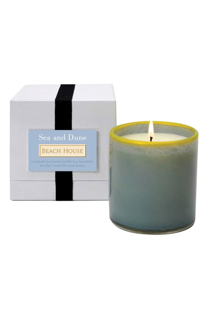 Enjoy the fragrance of sea, sand, and Summer sky with this pretty sea and dune beach house candle ($60) and the beauty of handblown glass vessel.