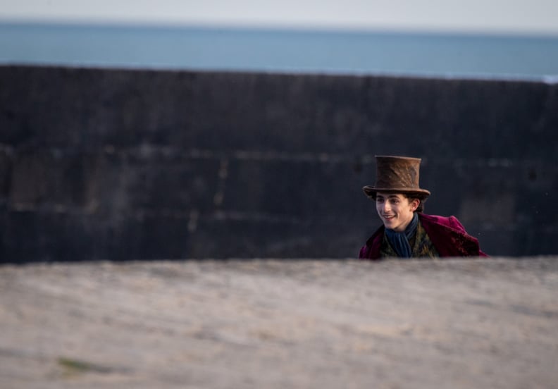 LYME REGIS, ENGLAND - OCTOBER 12: Timothée Chalamet is seen as Willy Wonka leaving the ship on the top of a van during filming for the Warner Bros and the Roald Dahl Story Company's upcoming movie 'Wonka' on October 12, 2021, in Lyme Regis, England. This 