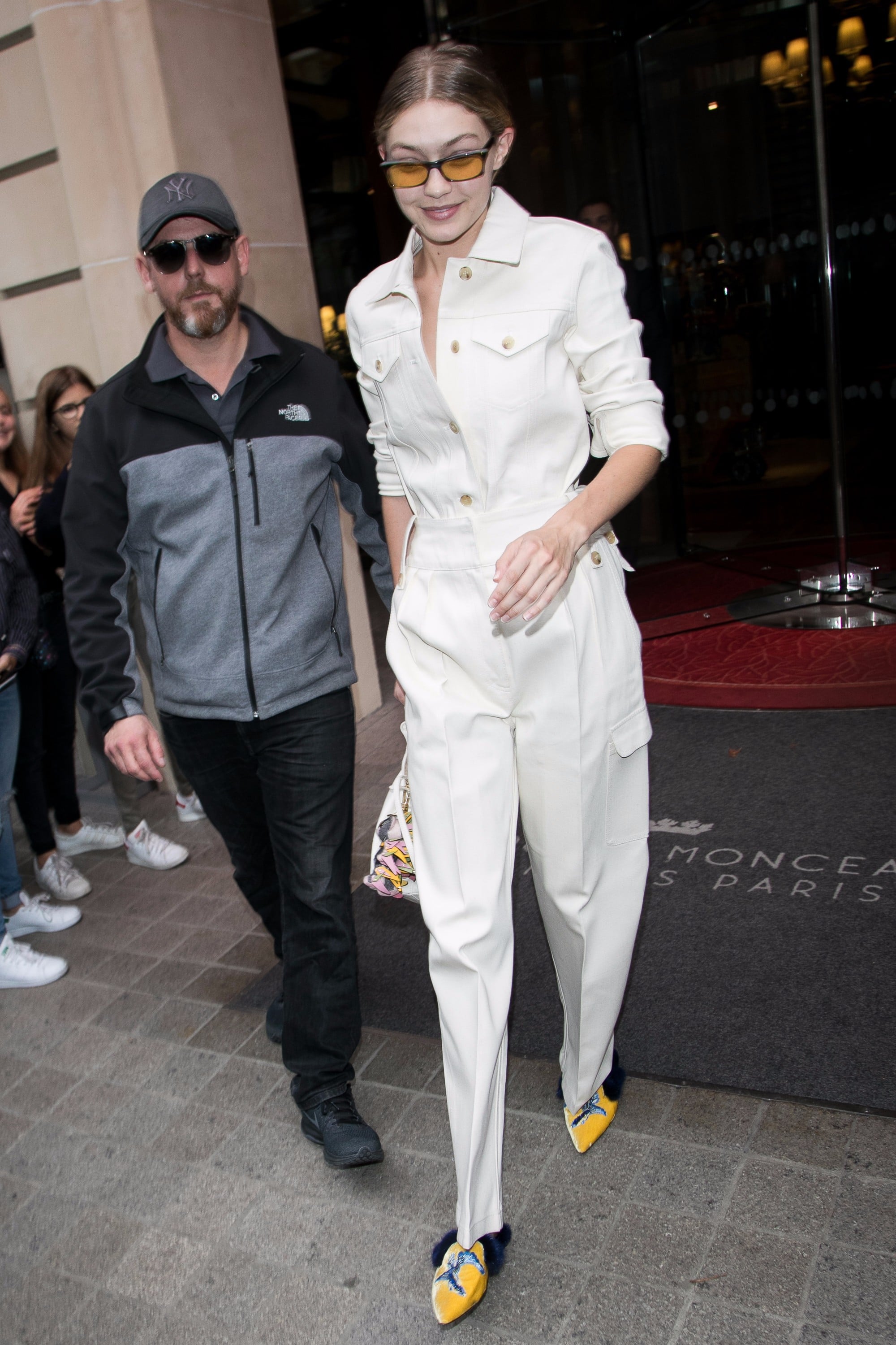 Gigi Hadid White Suit and Bear Bag