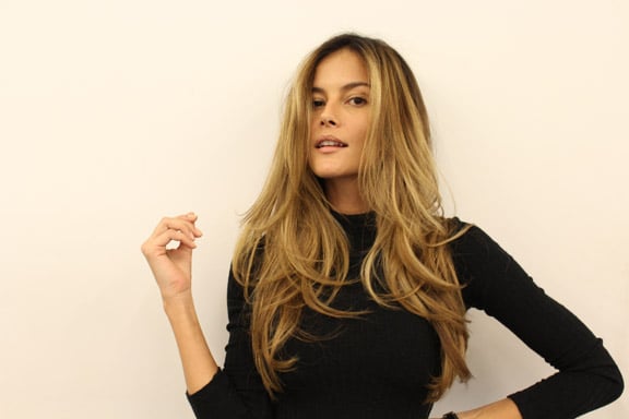 What we love about this hair color? She falls somewhere between brunette and blonde, with rich tones that bring our her complexion and hand-painted pieces that contour her face.