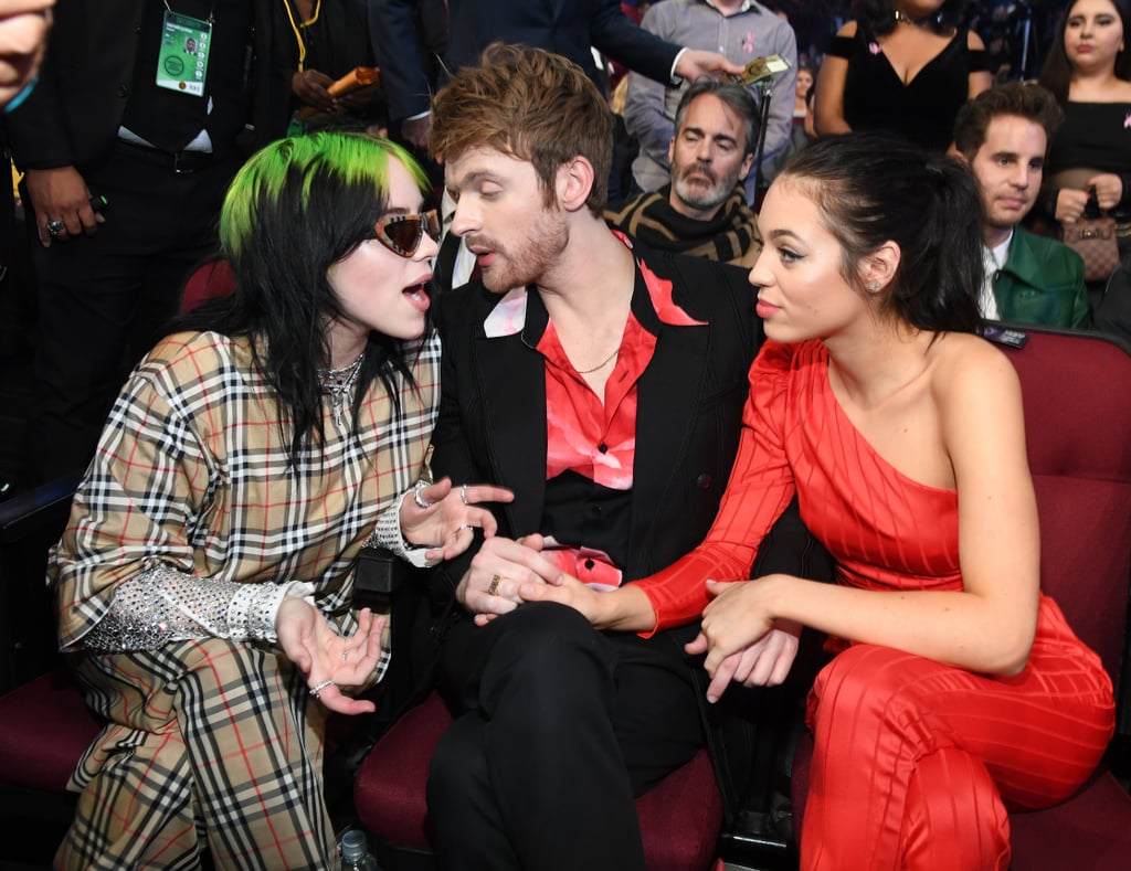 Finneas O'Connell and Claudia Sulewski with Billie Eilish at the American Music Awards in 2019