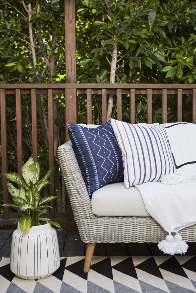 Most people think of accent decor as an inside-only design feature, but layers of pillows, blankets, and area rugs are just the thing to make your outdoor space feel like a cozy extension of your living room.