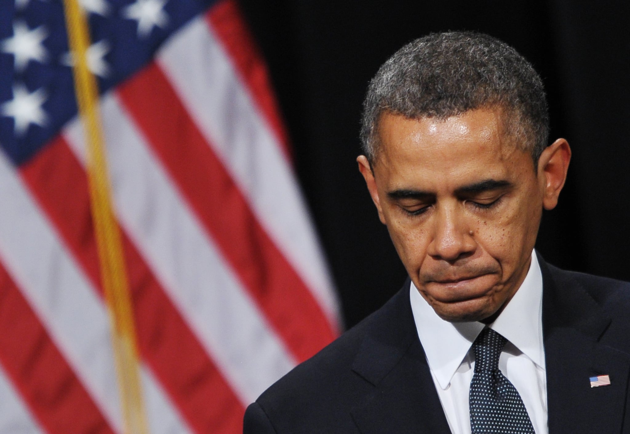 US President Barack Obama pauses as he speaks during a memorial service for the victims and relatives of the Sandy Hook Elementary School shooting on December 16, 2012 in Newtown, Connecticut. Twenty-six people were killed when a gunman entered Sandy Hook Elementary and began a shooting spree. AFP PHOTO/Mandel NGAN (Photo by Mandel NGAN / AFP) (Photo by MANDEL NGAN/AFP via Getty Images)