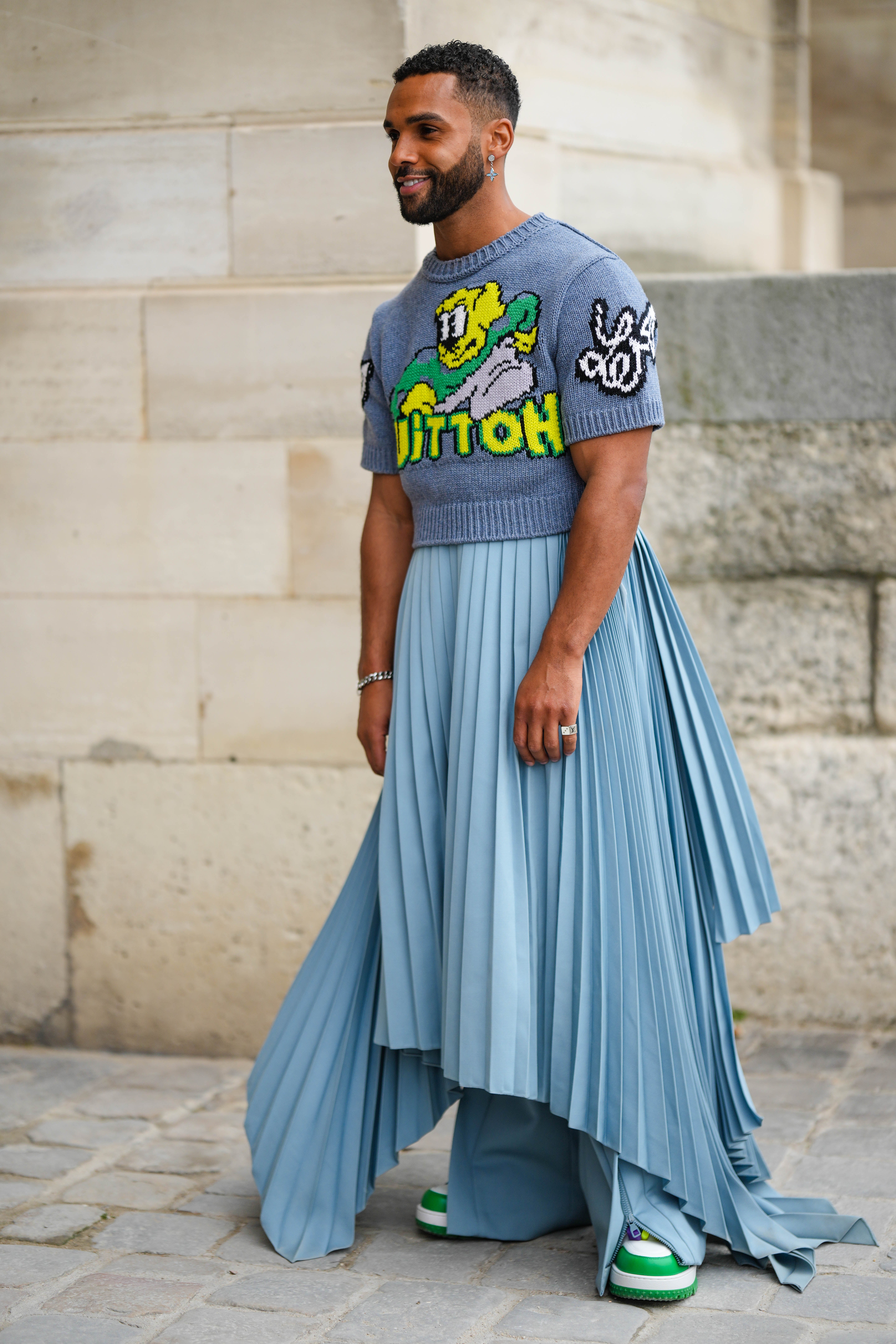Lucien Laviscount Attends the Louis Vuitton AW23 Menswear Show at Paris  Fashion Week, Emily in Paris's Lucien Laviscount Rocks a Pleated Skirt  at Louis Vuitton Show