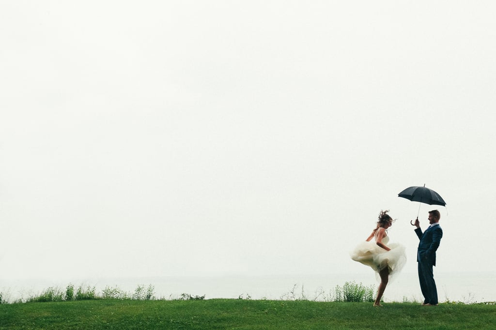 "It started to rain and this bride embraced it wholeheartedly. She started dancing and twirling around while her groom looked on. We adore these magical and spontaneous moments — they are what makes each wedding such fun to capture." — Jessica Hill, A Brit & A Blonde