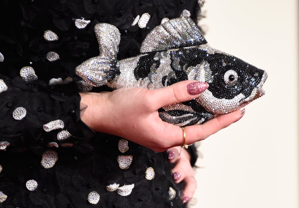 Kelly Osbourne's sparkling fish clutch was just as fun as her beaded Christian Siriano dress. And we want it in our closet, stat.