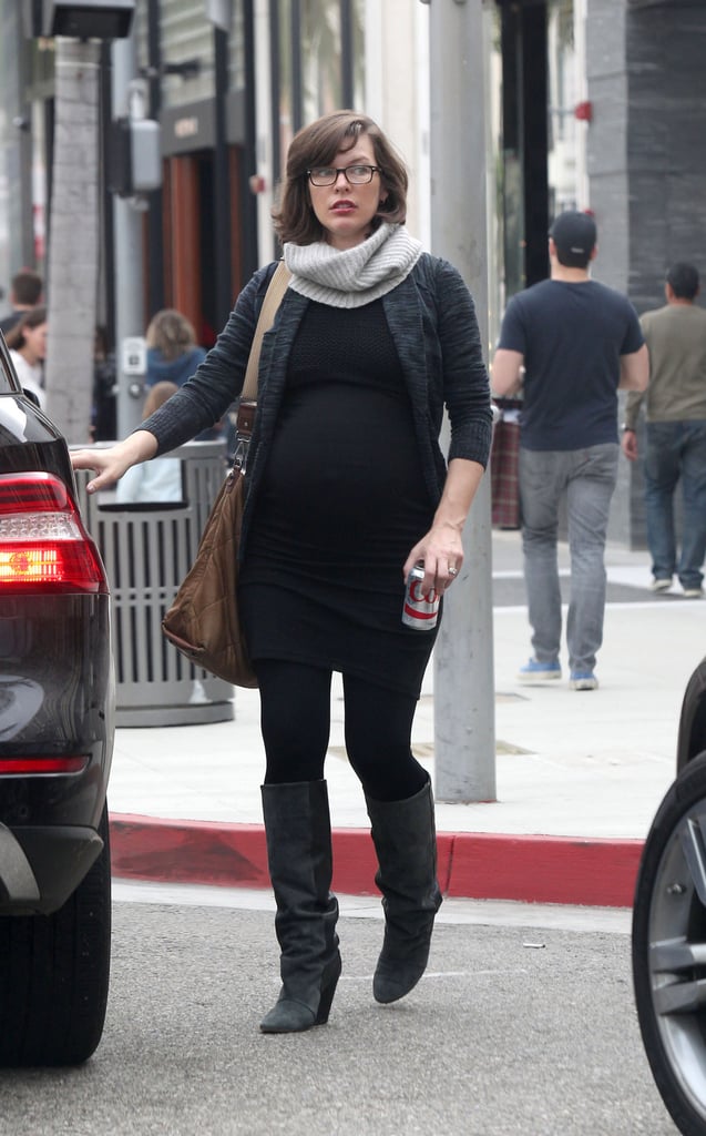 Pregnant Milla Jovovich showed off her bump while out in LA on Saturday.