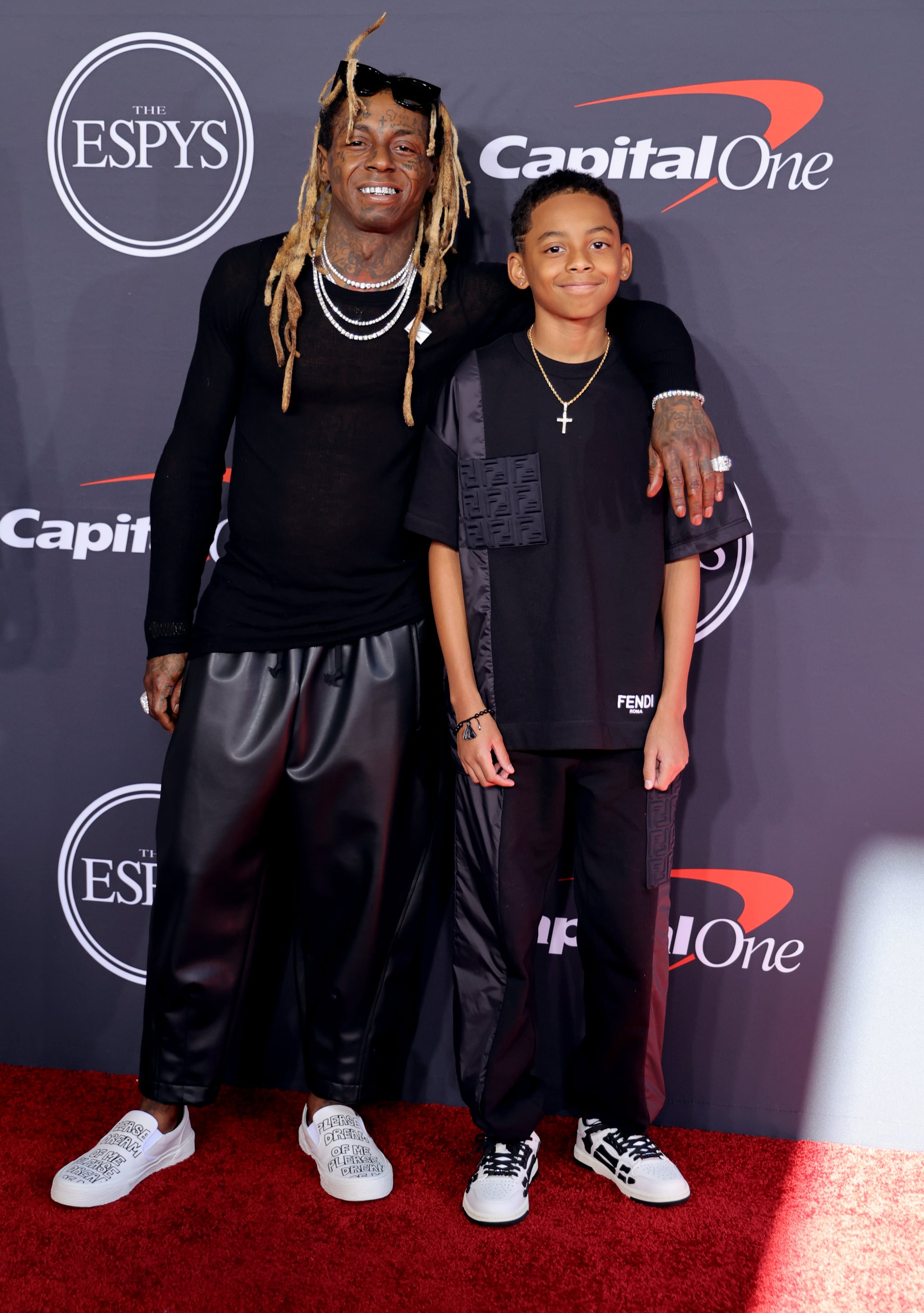 HOLLYWOOD, CALIFORNIA - JULY 20: (L-R) Lil Wayne and Kameron Carter attend the 2022 ESPYs at Dolby Theatre on July 20, 2022 in Hollywood, California. (Photo by Momodu Mansaray/WireImage)