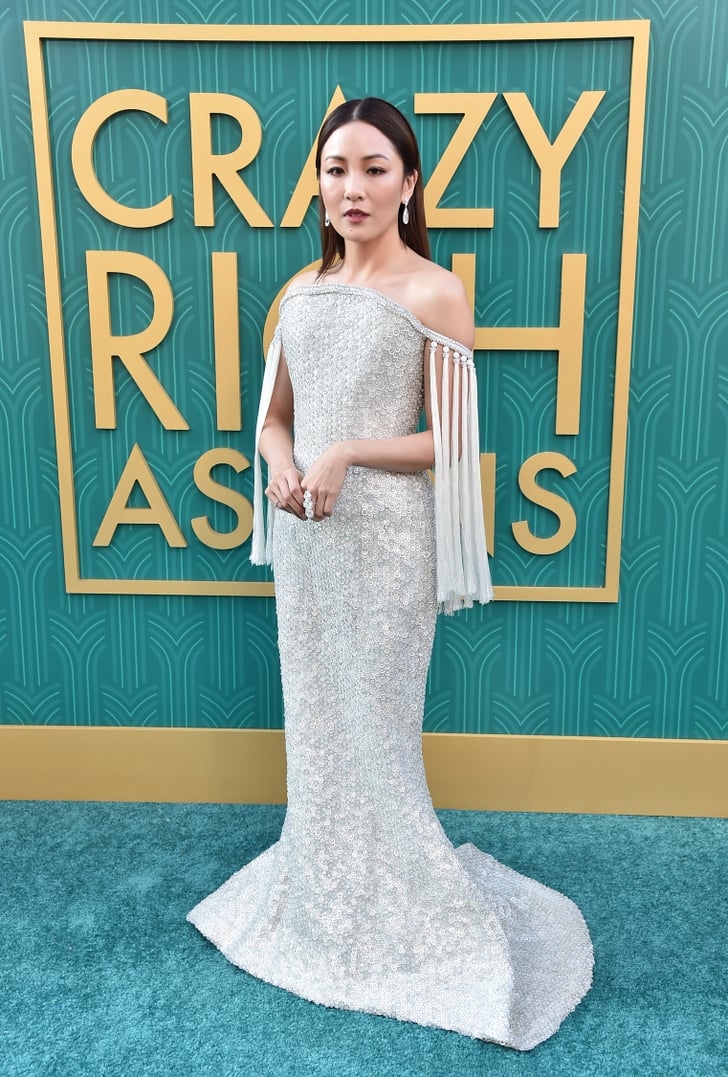 At the premiere of Crazy Rich Asians wearing a gorgeous off-the-shoulder gown by Ralph and Russo Couture with Lorraine Schwartz diamonds and Sophia Webster heels in 2018.