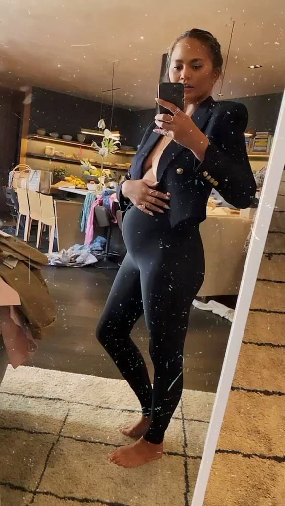 Chrissy Teigen Shows Her Baby Bump in Leggings and a Blazer