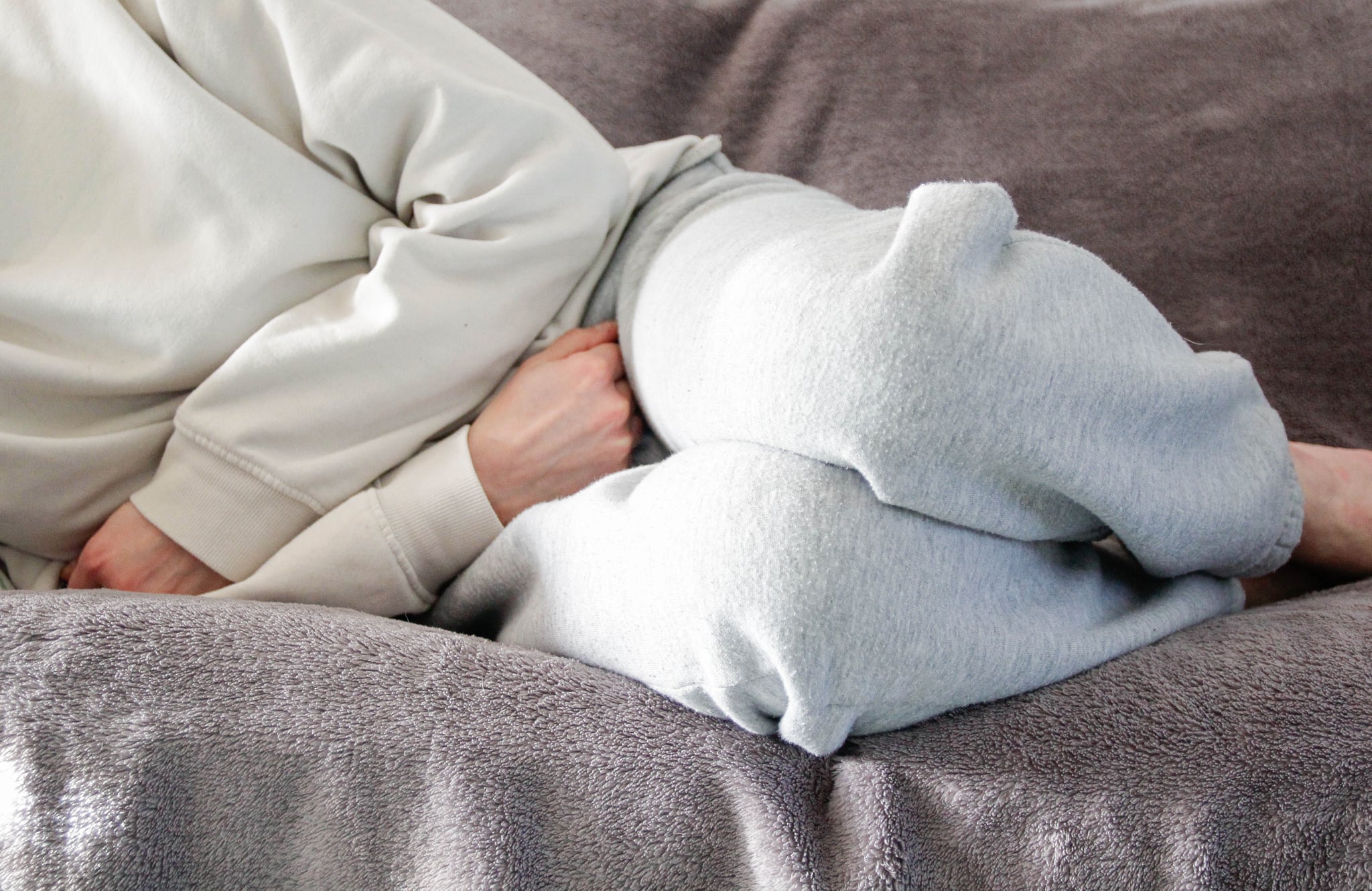 Woman on the couch in her luteal phase.