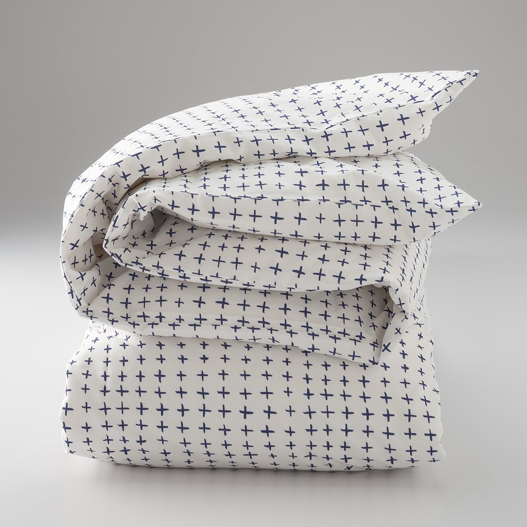 We love the airy playfulness of this 200-thread-count percale cotton duvet cover ($99-$135). Portland artist Ashley Goldberg hand-drew the rows of navy pluses so each is perfectly imperfect; it's unfussy style at its best. 
— Maggie Winterfeldt, home editor