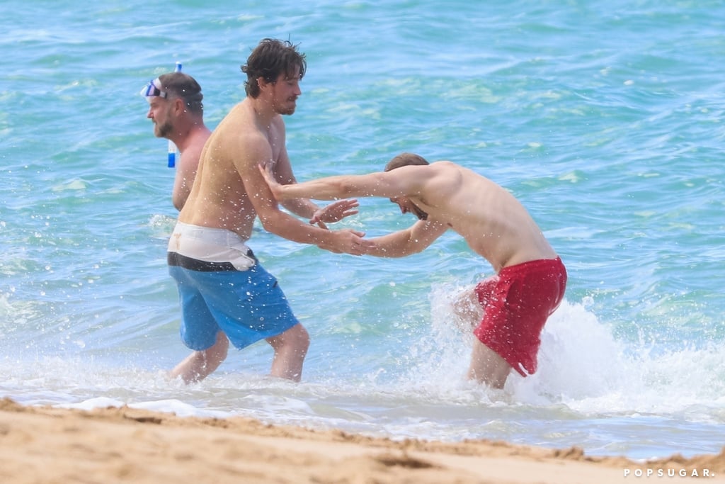 Charlie Hunnam and Garrett Hedlund Wrestle in Hawaii Photos