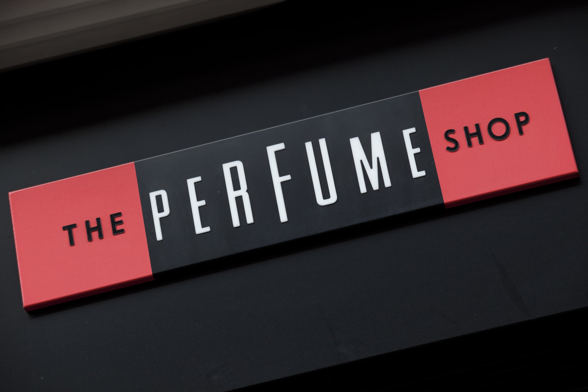 Sign for The Perfume Shop. (Photo by In Pictures Ltd./Corbis via Getty Images)