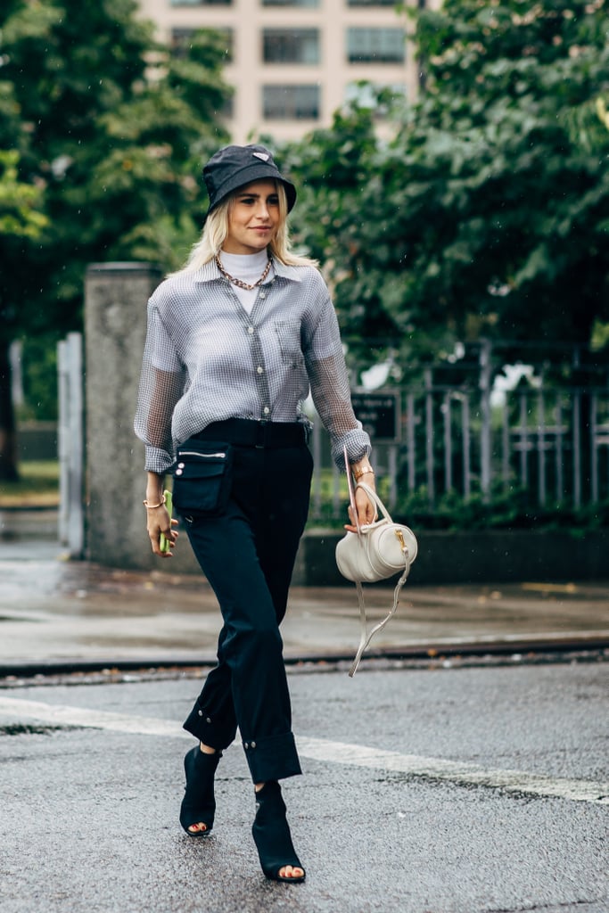 Style one with heels and smart slacks on a rainy day to play up the functional quality of your look.
