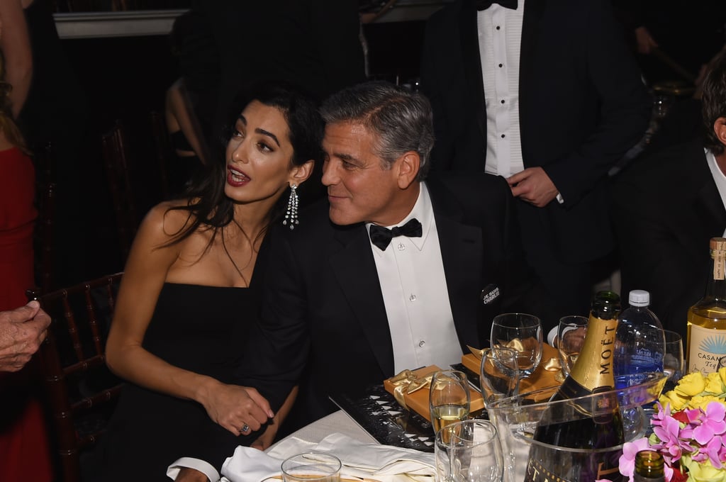 George Clooney and Amal Alamuddin chatted with friends from their table.