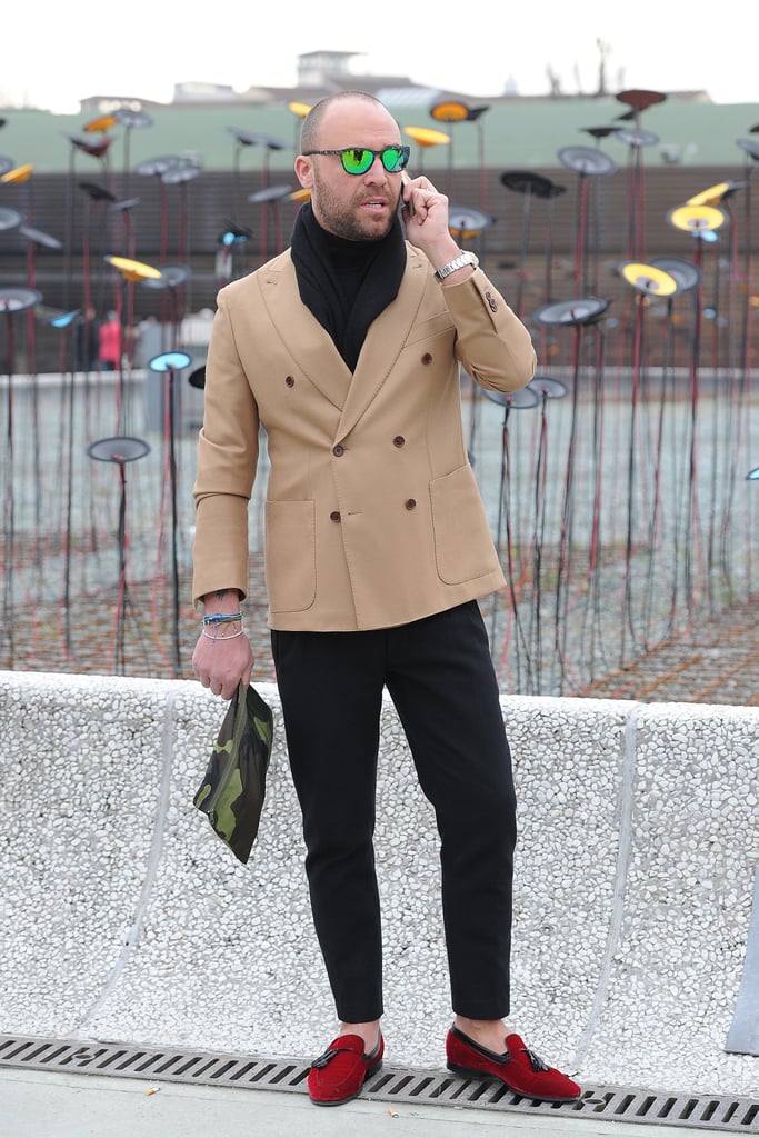 We can't decide what we love more: the jacket, the shades, the clutch, or those shoes — this guy nailed it.